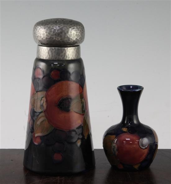 A Moorcroft Pomegranate conical sugar caster and a similar small bottle vase, c.1920, 17cm & 9.5cm